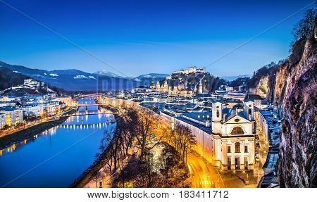Panoramic View Of Historic City Of Salzburg With Festung Hohensalzburg And River Salzach During Blue