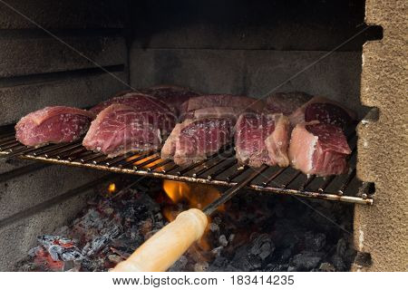 Close On Many Pieces Of Salted Picanha Barbecue Beef From Brazil Grilled On Wood Fire Still A Bit Ra