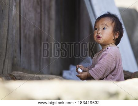 Sa Pa, Vietnam - 14 March, 2017: Unidentified ethnic Hmong minority baby portrait in the rural area of Sa Pa, Northern Vietnam, near the border with China.