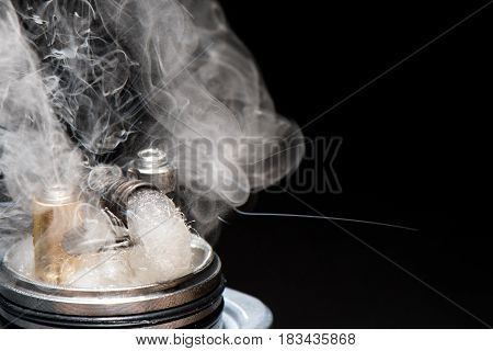 Winding Is Inserted Into The Drip Tip With Dipped With Liquid Evaporation Cotton With Lots Of Steam