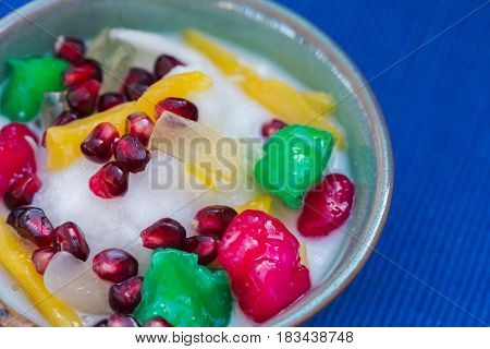 Tub Tim Krob is a Thai tropical fruit cocktail with shaved ice and coconut milk.