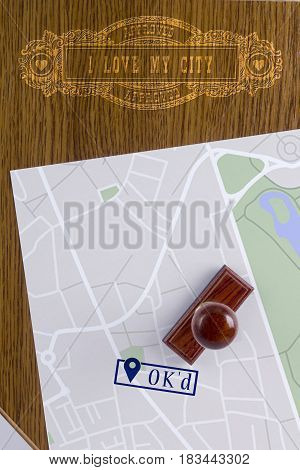 Abstract city map with a stamp OK'd and a vintage marker I Love my city.