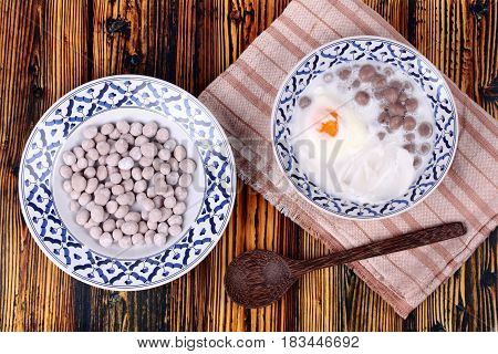 Purple Potato Dumplings With Poached Egg And Coconut Roll In Sweet Coconut Cream .