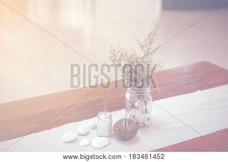 Bunch of tiny flower grass have decoration on wooden table