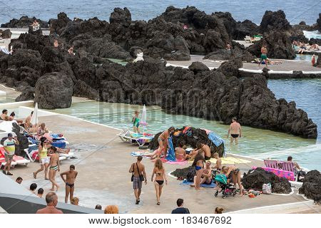 PORTO MONIZ MADEIRA PORTUGAL - SEPTEMBER 5 2016: Natural rock pool of Porto Moniz. It is a public bath with water from the Atlantic Ocean.