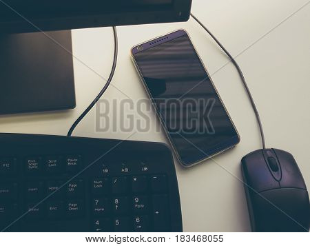 Headphone and Smartphone in Workplace, Isolated Elegance Background