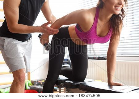Woman Workingout With Personal Trainer