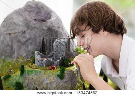 School Student Working On Model Building Project