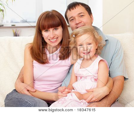 Happy family with daughter at home