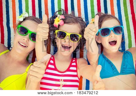Happy Children In The Swimming Pool