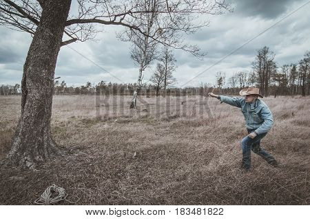 The Cowboy Throws The Knife Into The Tree
