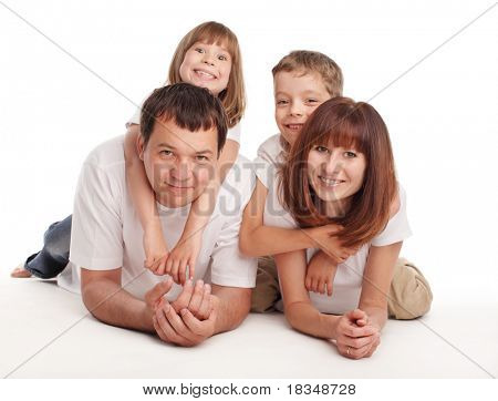 Happy family with two children isolated on white