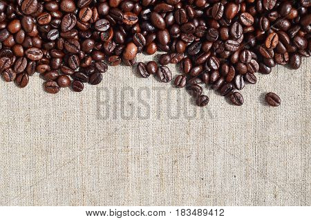 Texture Of A Gray Canvas Made Of Old And Coarse Burlap With Coffee Beans On It