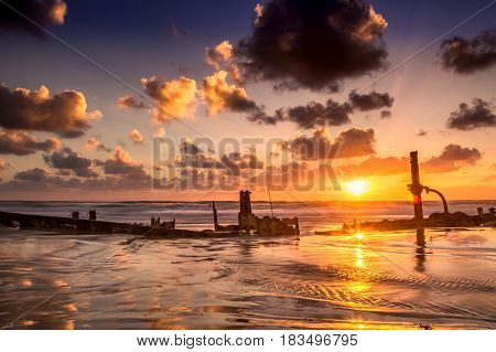 Sunken ship shot at sunset at Hof Dor, Israel.