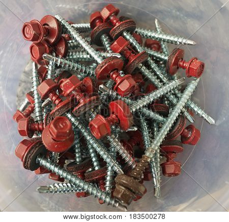 Hex Head Roofing Screws Plastic Boxes On The Construction Site, Macro Closeup