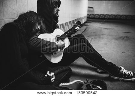Homeless Couple Man Playing Guitar Asking For Money Donation