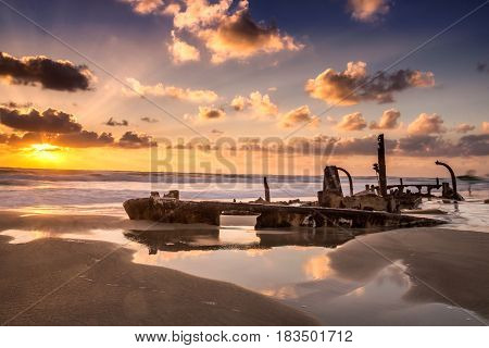Sunken ship shot at sunset at Hof Dor, Israel.