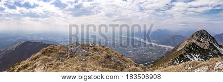 At the summit of Monte Chiampon right Monte Deneal left Monte Cuarnan in Italy in spring