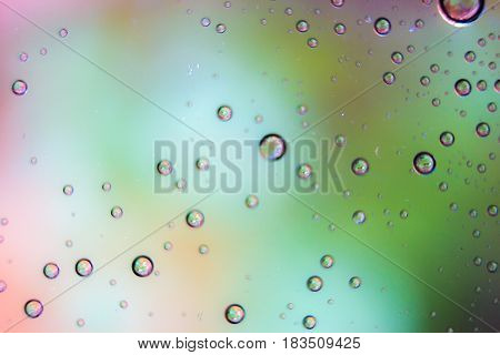Beautiful drops colorful bokeh blurred defocused dots soft lights background with selective focus.