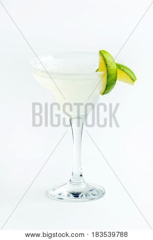 Citrus cocktail based on sparkling wine with ice and fruit for the company in a large glass on white