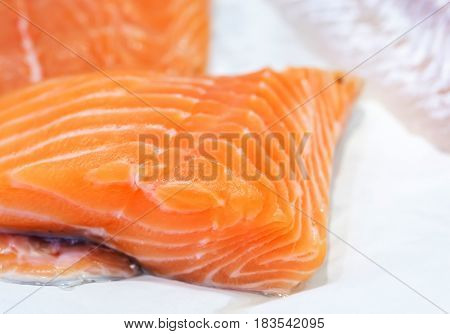 Fresh Uncooked Salmon Fillet On Showcase Of Seafood Market.