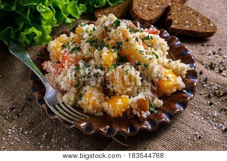 Homemade Fresh Couscous salad with tomatoes in plate