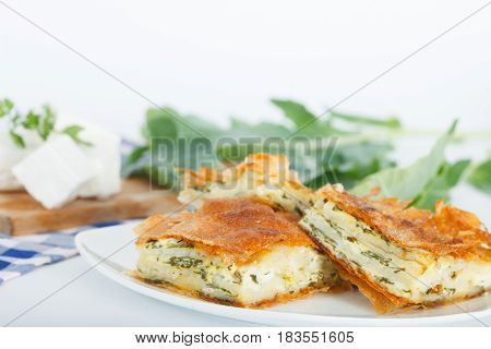 Plate of Freshly baked Serbian Traditional Zeljanica Spinach-cheese Pie slices