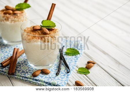 Creamy Rice Pudding Topped With Cinnamon And Almond