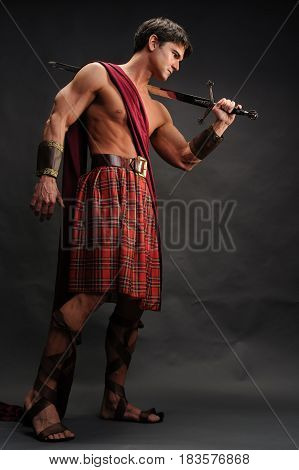 The muscular warrior is preparing for his epic battle.