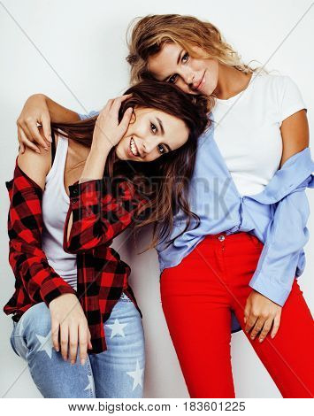 best friends teenage girls together having fun, posing emotional on white background, besties happy smiling, lifestyle people concept close up