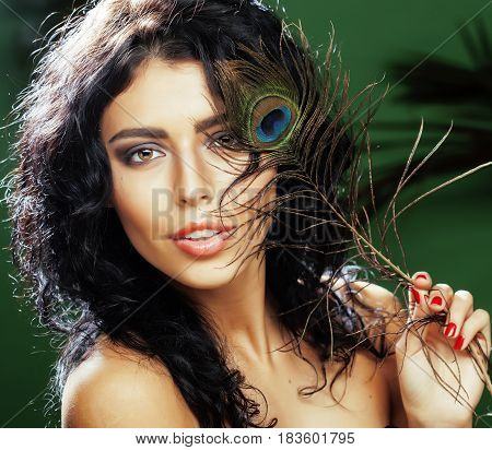 young cute blonde woman on green palm background smiling happy, lifestyle peole concept close up
