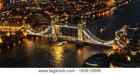 London aerial view with dominant of Tower Bridge at night. London is one of the most beautiful historical city in the world.