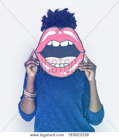 African Woman holding Paper Mouth Over her Face
