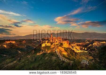 Civita di Bagnoregio ghost town landmark aerial panoramic view on sunset. Lazio Italy Europe.