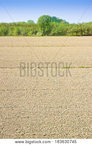 Plough agriculture field before sowing - Plowed field background with copy space