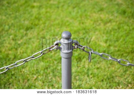 Iron pole in green background - concept image