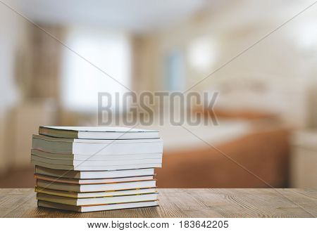 books on old wooden table in the bedroom