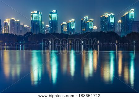 River And Modern Buildings Against Sky at nightreflection of cityscape in rivershot in ShanghaiChina.