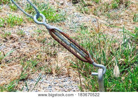Closeup to Rusty Metal Eye and Hook Turnbuckle