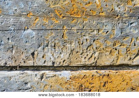 Fragment of the wall of an old wooden house.