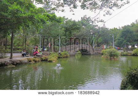TAIPEI TAIWAN - DECEMBER 7, 2016: Unidentified people visit 228 Peace Park. 228 Peace Park is located in the middle of Taipei downtown.