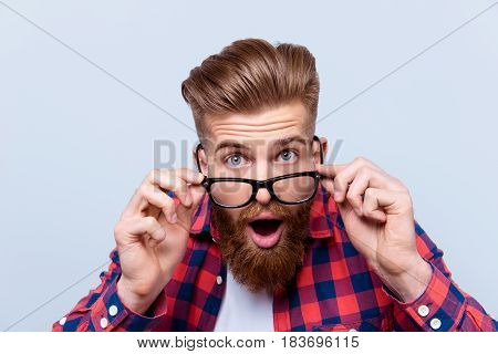 Close Up Portrait Of Shocked Amazed Man In Checkered Shirt Touching His Glasses