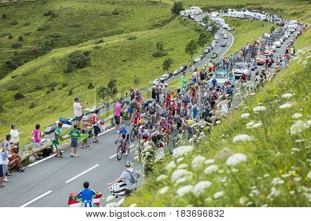 Col de PeyresourdeFrance- July 23 2014: The peloton (Gruppetto) climbing the road to Col de Peyresourde in Pyrenees Mountains during the stage 17 of Le Tour de France on 23 July 2014.