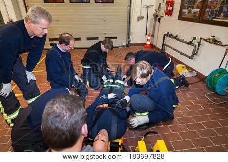Hamburg, Germany - February 07, 2013: German firefighter team in an exercise with a injured in a stretcher