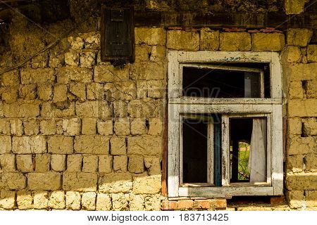 Roztots'ka Pastil' Ukraine - April 25 2017: Window of an abandoned old house made of adobe on the outskirts of the village in the south-western Ukraine.