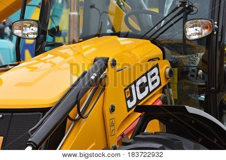 VILNIUS LITHUANIA - APRIL 27: JCB heavy duty equipment vehicle and logo on April 27 2017 in Vilnius Lithuania. JCB corporation is manufacturing equipment for construction and agriculture.