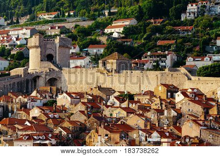 Protective city wall, Minceta tower and houses with red tiles in Dubrovnik, Croatia