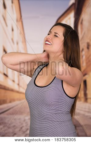 Beautiful lady Suffer crick after workout in the street.
