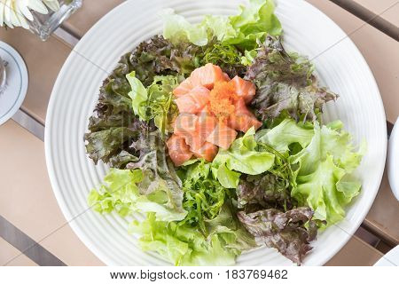 The salmon salad served with shoyu sauce.