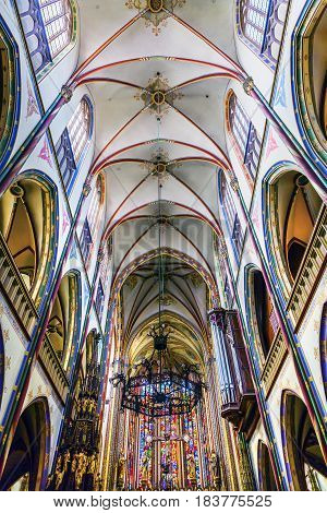 AMSTERDAM, NETHERLANDS - MARCH 30, 2017 Basilica Christ Crucifix Stained Glass De Krijtberg Church Amsterdam Holland Netherlands. Roman Catholic Church built in 1883 maybe the most beautiful church in Amsterdam.